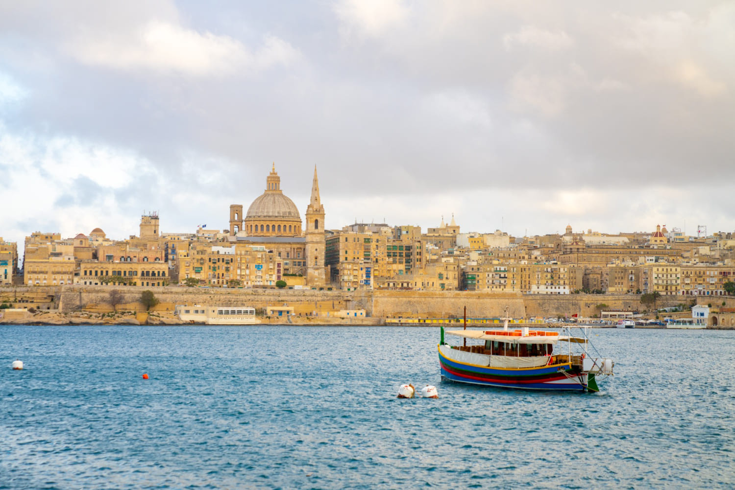 Pakistani students studying at a Maltese university campus surrounded by historic architecture